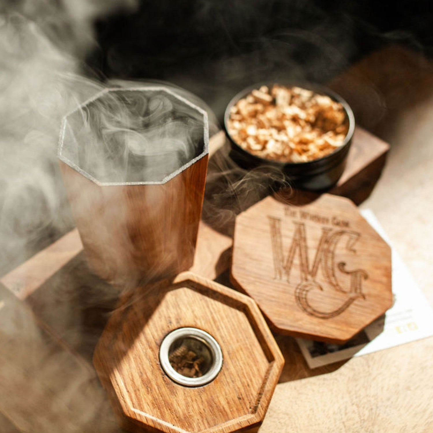 Wooden smoking device with smoke, bowl of white oak, and branded topper
